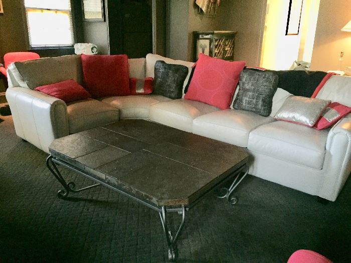 Gray leather sectional sofa and slate top coffee table 