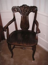 Antique 19th century American oak carved chair featuring the North Wind (face) on back.