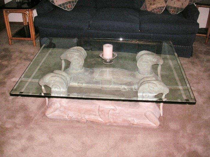 Glass coffee table with ram base