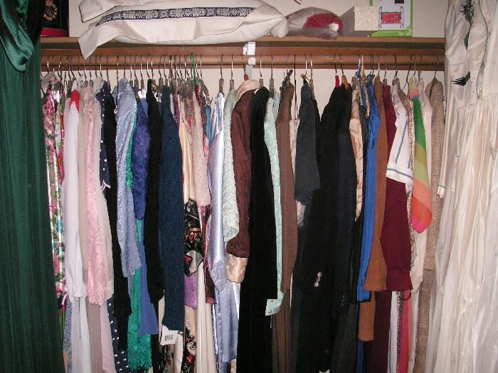 This closet has a lot of lingerie & formal gowns