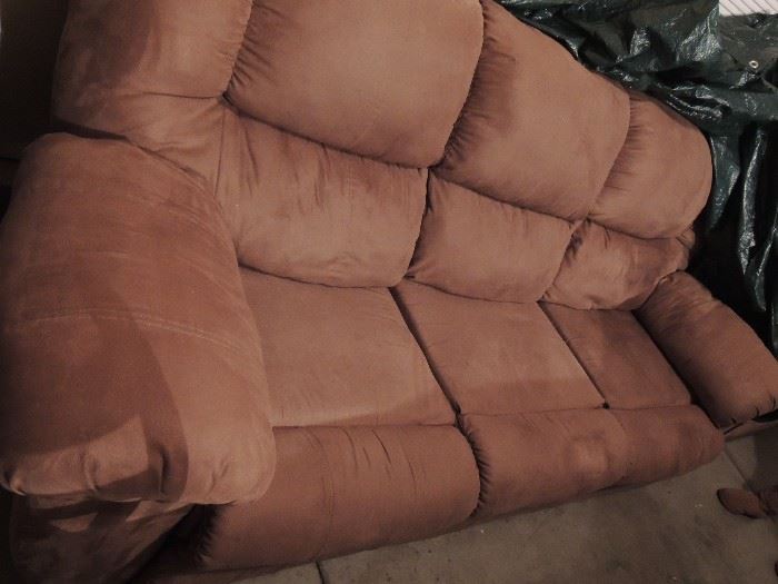 Tan reclining couch. Recliner on both ends. $300.