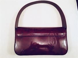 42. Cartier Paris Burgundy Leather Handbag