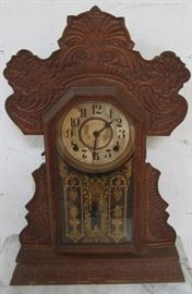 Carved mantle clock
