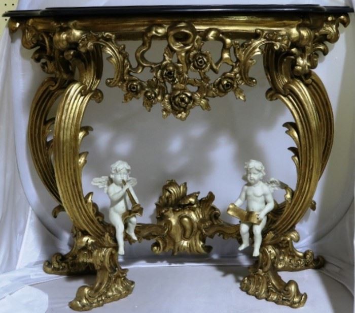 Matching French gilded console w/ cherubs