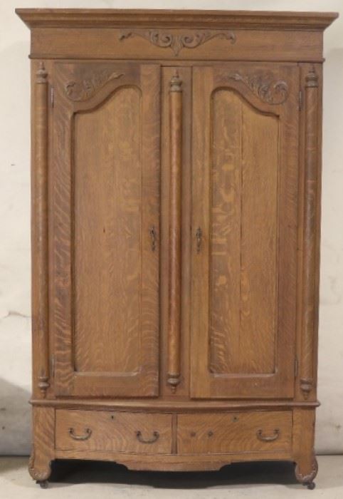 Fancy carved oak wardrobe