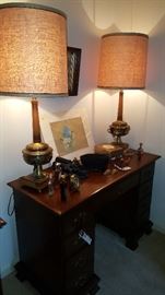 Desk and brass lamps