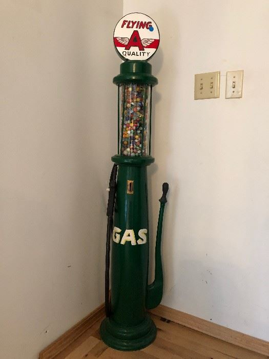 Wood replica of vintage gas pump with antique marbles. 