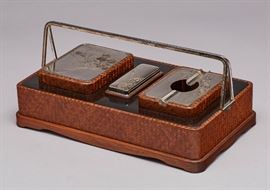  Meiji Mixed Metal Japanese Basketweave Smoking Set   Meiji Japanese mixed metal and basketweave smoking set. Japanese Meiji period three piece smoking set includes a sterling silver rimmed, glass lined covered ashtray with a silver lid and engraved florals, a silver matchbox with engraved florals, and mixed metal cigarette box with engraved florals and copper leaves. The accoutrements are set into a black lacquer and basketweave case with double silver swing handles. Includes the original wooden gift box with cover. Unsigned but has been tested to be .925 sterling silver or higher grade. Good condition, almost unused. Measures 3 inches high x 10.5 inches wide x 6.2 inches deep.