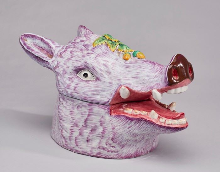  French Faience Majolica Boar's Head Tureen.           Mid 20th century French Faience Majolica pottery boar's head tureen. The lavender or purple hand painted face of the boar has an embossed acorn and oakleaf decoration on the top. Hand painted mark on underside, France. Measures 9.7 inches high x 15.6 inches long. In good condition.
