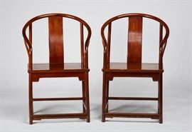 Pair Carved Chinese Huanghuali Horseshoe Armchairs Pair of 19th century or older Chinese Huanghuali horseshoe armchairs. Chairs have a simple molded carved apron. Good condition, one has all four legs ended out and the other has back legs ended out. Measure 40.2 inches high x 23.2 inches wide x 17.6 inches deep.