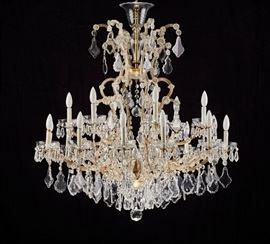 Plaza Hotel New York - Louis XV Crystal Chandelier     Palatial Louis XV style crystal chandelier from New York's legendary Plaza Hotel. The sparkling crystal and brass twelve arm chandelier once graced the famed Presidential Suite of the glamorous and celebrated New York City landmark hotel where a room in the suite today can run $30,000 per night. The hotel closed its doors in April 2005 to undergo an extensive $350 million renovation and restoration. The stunning chandelier was sold with the contents of the of the glamorous and celebrated New York City landmark hotel at the Christie's, New York - March 15, 2006 auction. The classic circa 1930's chandelier is marked Made in Czechoslovakia. Good working order, some minimal prism loss. The chandelier sold at the 2006 auction for $4250 and is pictured on page 173 of the Christie's auction catalog, lot number 320. Measures 43.5 inches high x 41 inches in diameter. A copy of the March 2006 - The Plaza - Christie's auction catalog with pri