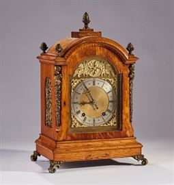 German 19C Winterhalder & Hofmeier Bracket Clock     German 19th century Winterhalder & Hofmeier clock. Clock has an oak case with brass ormolu mounts and pierced ormolu inset sides. It has strikes at the quarter and half hour. It is running and striking at this time, but we do not guarantee timepieces to run. In good condition. Measures 16.3 inches high x 10.5 inches wide.