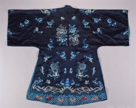  Chinese 19th Century Embroidered Silk Court Robe  Chinese 19th century embroidered blue silk court robe. Beautiful multicolored embroidered wave border. Silk ground is skillfully hand embroidered in four blue silks with peonies and butterflies in satin stitch and peking knot. In good original antique condition, shows appropriate small marks and signs of wear. Original patterned blue silk lining shows signs of wear, but is stable. Rich colors still bright and vibrant Measures 47 inches long.