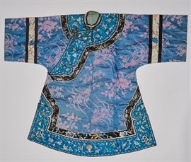 Chinese 19C Antique Oriental Embroidery Qing Robe  Late 19th or early 20th century antique Qing Dynasty Chinese robe. The classic side fastening robe for an affluent woman is silk damask accented with elaborate embroidered panels on a rich blue and black silk ground. The silk panels are finely hand embroidered with intricate embroidery in tiny silk floss stitching depicting birds in flight amongst exotic foliage. The robe is backed with hand woven pale blue silk backing that is hand sewn. In good condition. Measures 40 inches in length and 50 inches across from arm to arm. The antique textile is in very good condition and it appears was rarely if ever worn.

From the estate of Dr. J. Ward Hall, dentist to the Chinese Imperial Family, personal dentist to the Emperor of China. Antique textile will include photos taken in the 1880's showing the interior of Dr. Hall's Shanghai residence with his collection of Chinese textile on the wall and porcelain. Chinese robe will also include origina