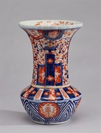 Antique Japanese Paneled Floral Imari Vase                      Antique Japanese paneled floral Imari vase.The Japanese Imari vase has a flared scalloped rim and fluted neck. Late 19th or early 20th century. Good condition. Measures 9.6 inches high x 6.2 inches diameter.