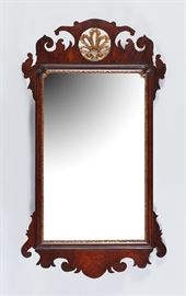  English 19C Mahogany Chippendale Gilt Shell Mirror     Early 19th century mahogany Chippendale mirror with carved, gilt shell form at the top. In good condition. Measures 39.5 inches high x 22 inches wide.