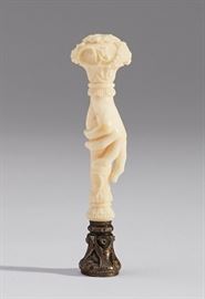 French 19C Carved Ivory Hand Silver Agate Wax Seal   French 19th century carved ivory hand silver agate wax seal. The 19th century French ornate wax seal depicts a carved ivory hand which is topped with a bouquet of flowers and has a chased French sterling silver stamp with a dog head mark that is inset with a carved agate coat of arms. Good condition. Measures 3.6 inches long. 