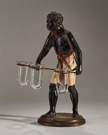 Antique Figure of Black Man carrying miniature glass vases.