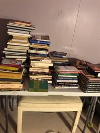 lots of books, paperbacks, hardcover, cook books, art books