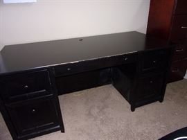 Black desk(needs tlc) at edge. A little touch up paint where chair rubbed.