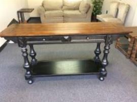 Black Wall Table with Brown Wood Top and Felt Lined Drawers.