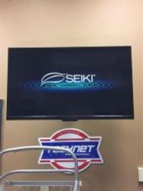 Seiki 40” Flat Screen Television w/ Swivel Wall Mount and Remote.