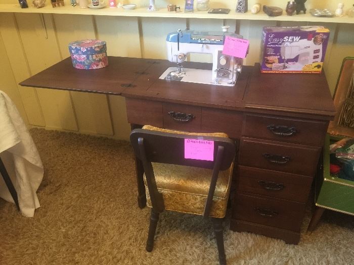 Sewing machine in cabinet and sewing chair with seat storage