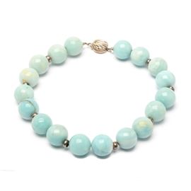 Sterling Silver and Blue Agate Beaded Necklace: A sterling silver and blue agate beaded necklace.