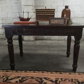 Occasional table with drawer carved, made in Indonesia or India.