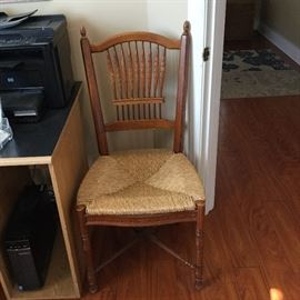 Caned chair in room off lobby 