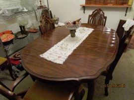Dining table with 6 chairs. 4 side chairs, 2 arm chairs.