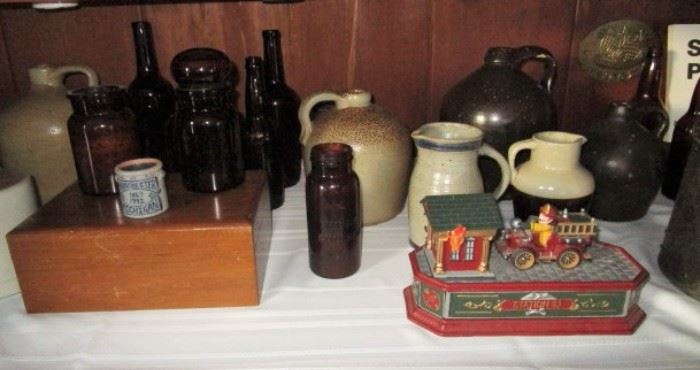 Amber bottle collection, some w/ advertising, cast iron bank, Salt glaze and Albany slip stoneware, wooden box