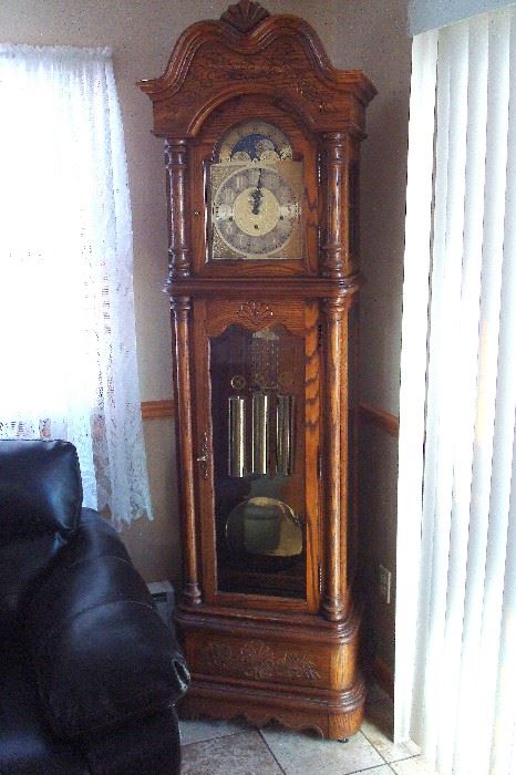 Howard Miller grandfather clock in good running order.