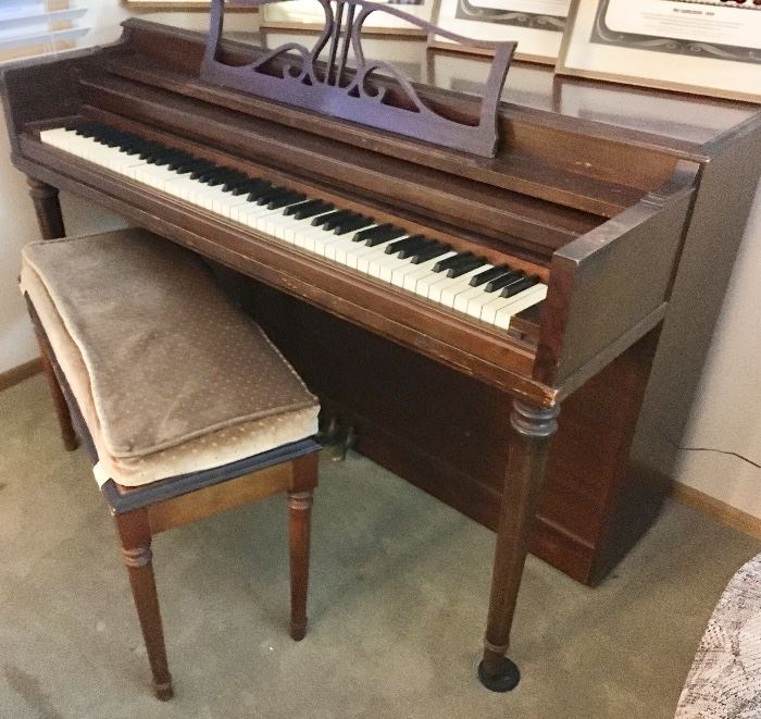Upright piano with bench