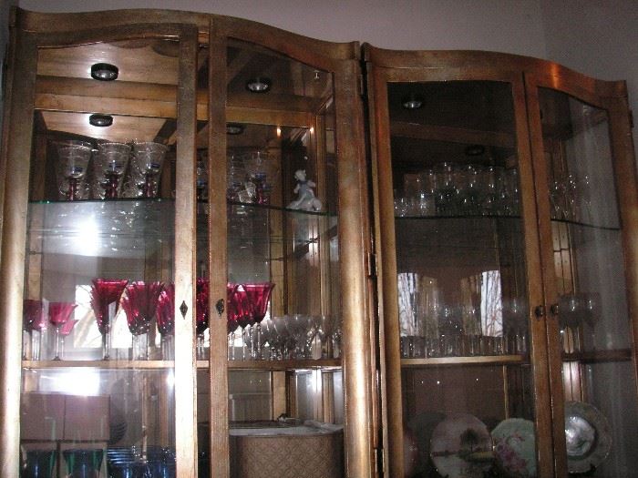 Large gold, lighted cabinets
