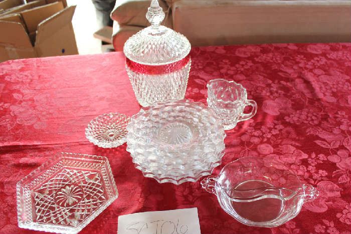 Lot #6 Collectable Glass Dishes.  Lot Includes:
Six 8 inch Fostoria American Pattern plates
Fostoria divided serving or candy bowl 6 inches
Small Hexagon Serving bowl 7 inches
Fostoria American pattern cream server
4 inch small candy dish
6 in x 10 in candy dish red & crystal