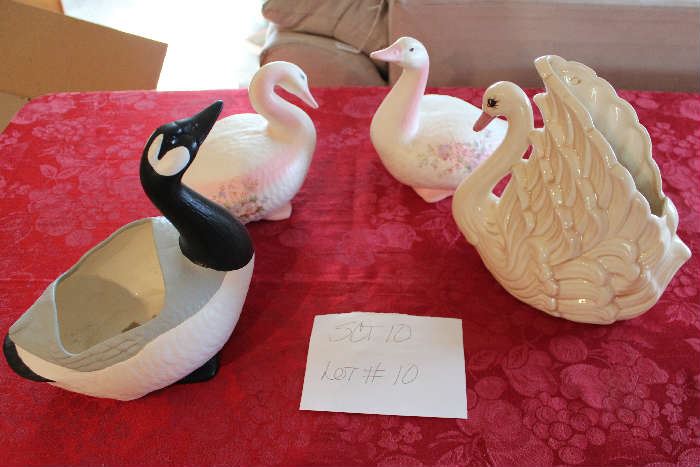 Lot #10 Birds of a Feather 
These lovely birds are sure to brighten your home!
Lot includes the following items:
2 pink floral ceramic ducks
1 black, grey & white goose vase
1 Swan vase white with pink bill