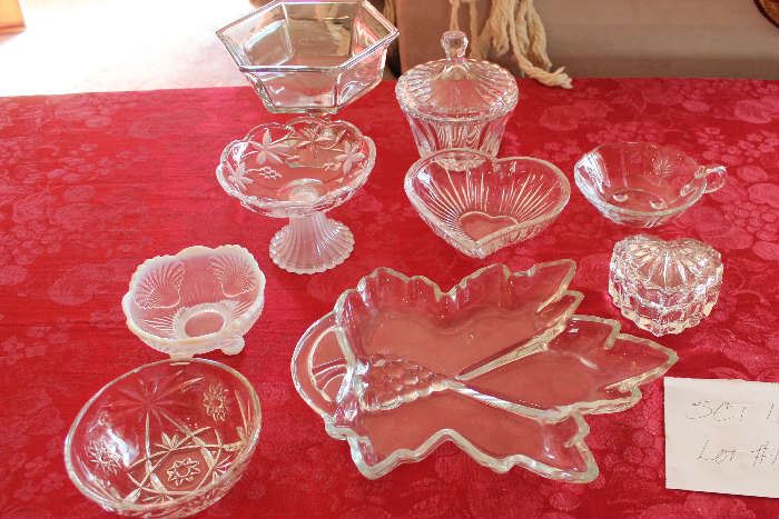 Lot #12 Beautiful glass for your home!
Lot includes the following items:
Grape leaf try 12 inches
Small bowl with handle 5 inches
Heart bowl 6 inches
Small anchor hocking bowl 5 inches
Small milk glass bowl  5 inches
Larger candy disk 7 in
Small candy dish 5.5 in
Candy dish with lid 5 inches
Crystal heart jewelry holder with lid 4 in
