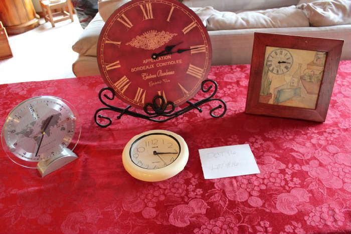 Lot #16 Four Clocks.  These 4 clocks will help you keep time!
Small white Salton wall clock 6.5 inches
Sharper Image world time glass clock - 8 inches
Clay Company California Clock with stand or hang - 10 inches
Appellation Bordeaux Clock with stand 13 inches