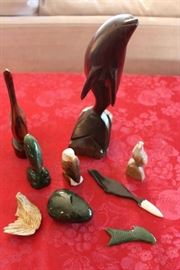 Lot #26 Handmade collectables out of Jade, Walrus Tusk, Wood and Whale Baleen
Lot Includes the following:
Large polished Jade rock
Carved jade fish - flat
Wood carved eagle 
Stone carved eagle
Carved jade fish - standing
Carved Eagle - walrus tusk
Carved seal - whale baleen
Carved wood dolphin
Carved wood swan