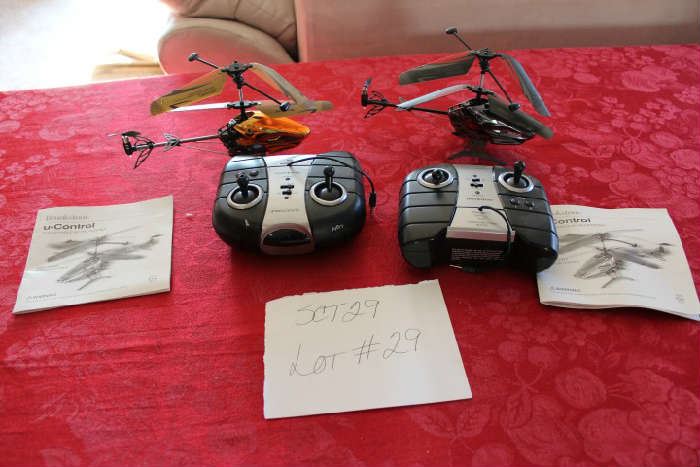 Lot #29 Two Brookstone u-control cloud Force RC Helicopters
Two remote control helicopters with remotes and manuals. Unknown if they work.  Not tested.