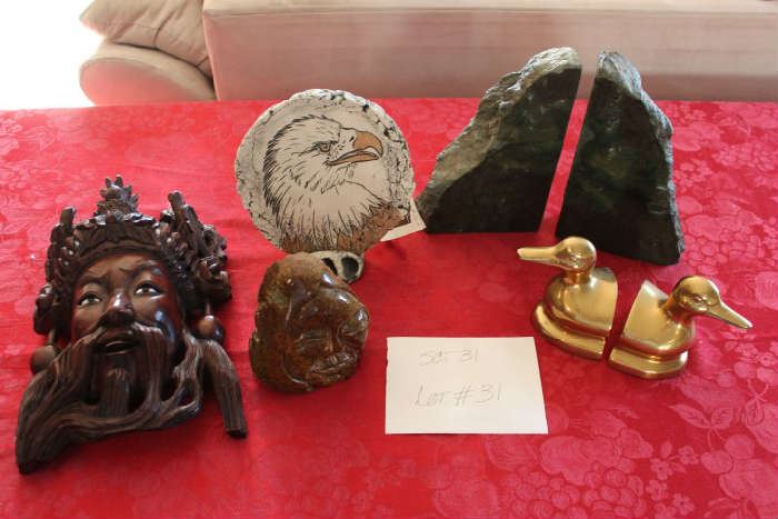 Lot #31 Decorative Items for Books and Display
Set of Brass Duck Bookends
Set of Green Granite Bookends
Brown Granite carved face
Clay made with St. Helens ash - Bald Eagle with Stand
Carved Wood Mask