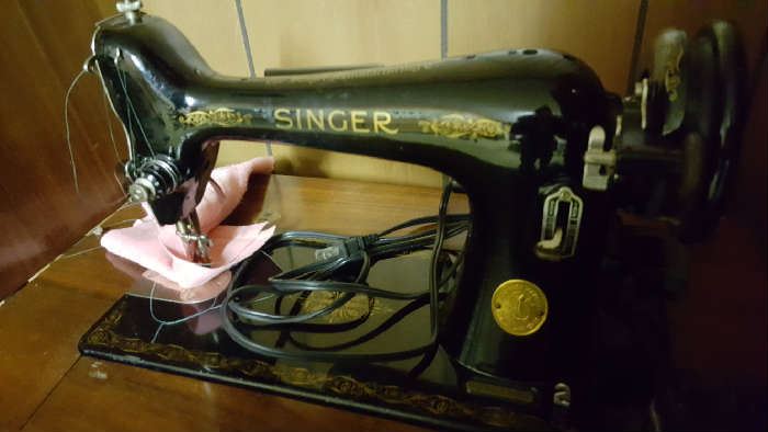 Vintage singer sewing machine and cabinet and bench