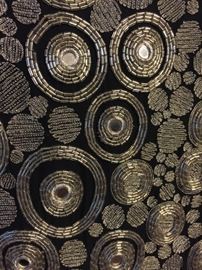 Design detail on metallic dress