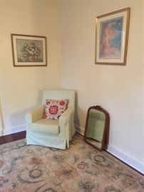 Slip cover chair, Mirror, Framed Art, Area Rug.