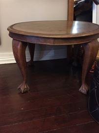 Small round walnut table with ball and claw feet.
