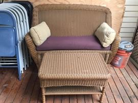 Wicker style love seat and table
