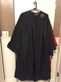 4 Oak Hall Graduation Gowns (2-red 5'6" - 5"8"), (1 - black 6'0" - 6'2"),  (1 - black with UW logo 5'9" - 5"11"),, 1 black cap.