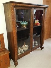 Antique tiger wood curio cabinet