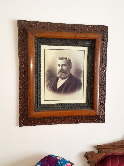 Gorgeous wood frame. Antique portraits